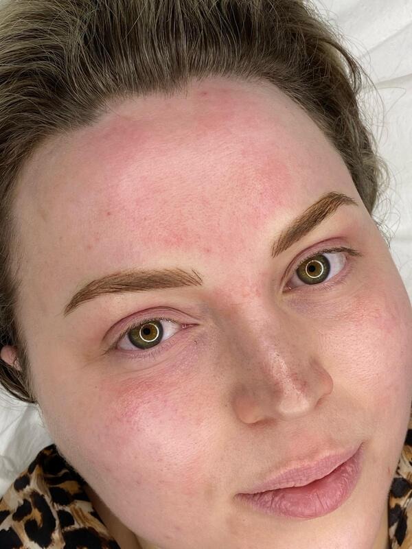 A woman with full, defined brows